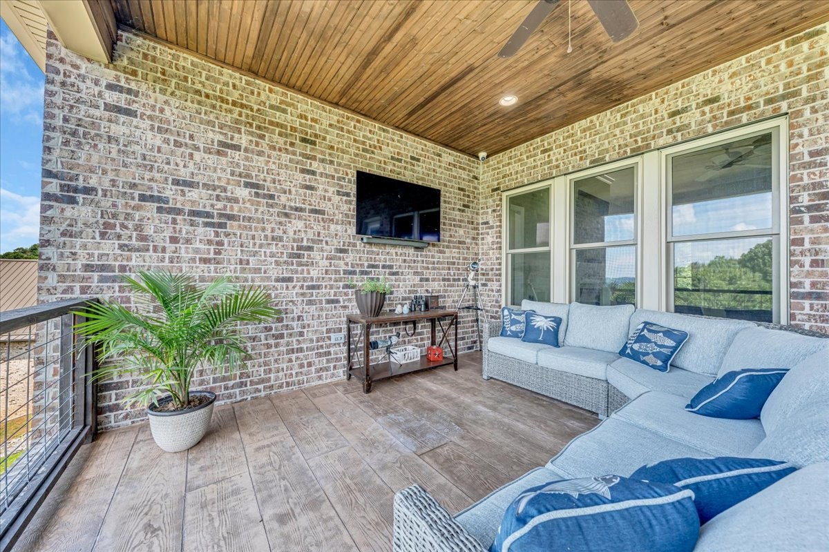 667 Rutherford Lane Smithville, TN 37166 - Photo 65 of 89 a outdoor living space with furniture and a flat screen tv