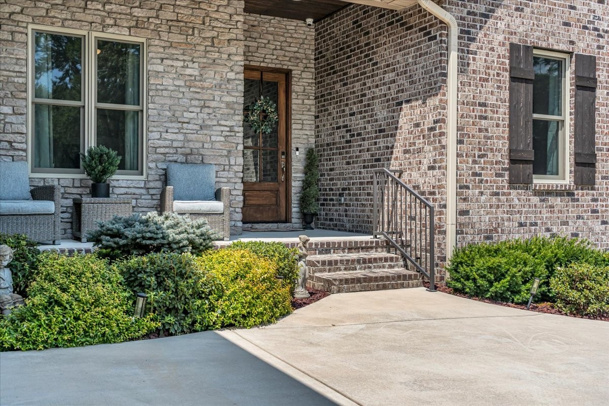 667 Rutherford Lane Smithville, TN 37166 - Photo 8 of 89 a front view of a house with a garden