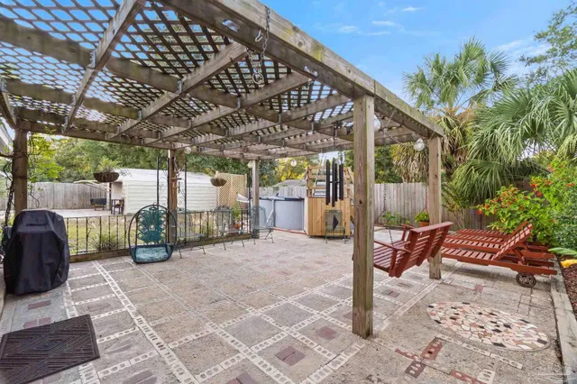 a view of a backyard with sitting area
