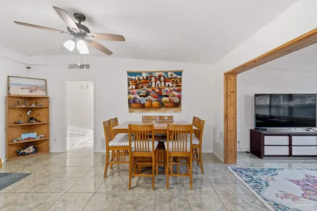 a dining room with furniture and window