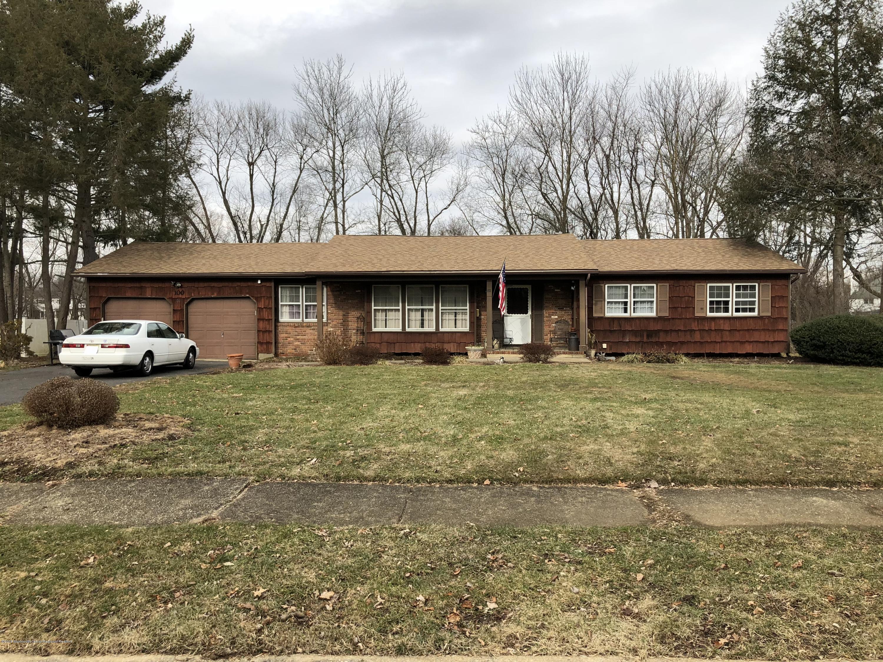 100 Sargent Road Freehold, NJ 07728 - Photo 1 of 30 a front view of a building with garden