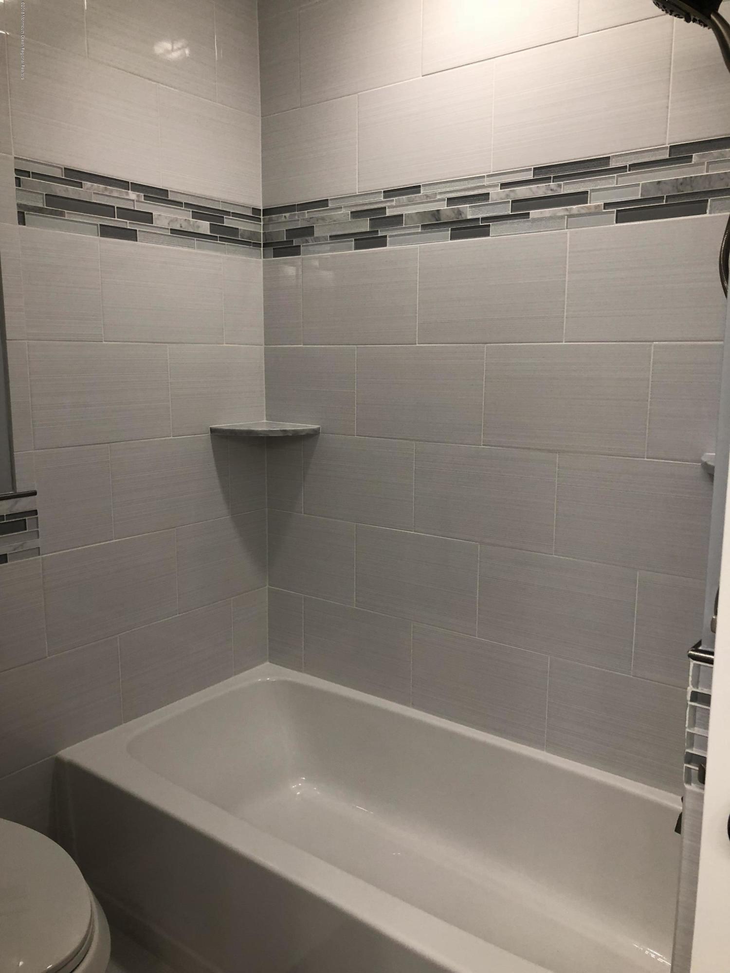 100 Sargent Road Freehold, NJ 07728 - Photo 12 of 30 a bathroom with a shower and a toilet