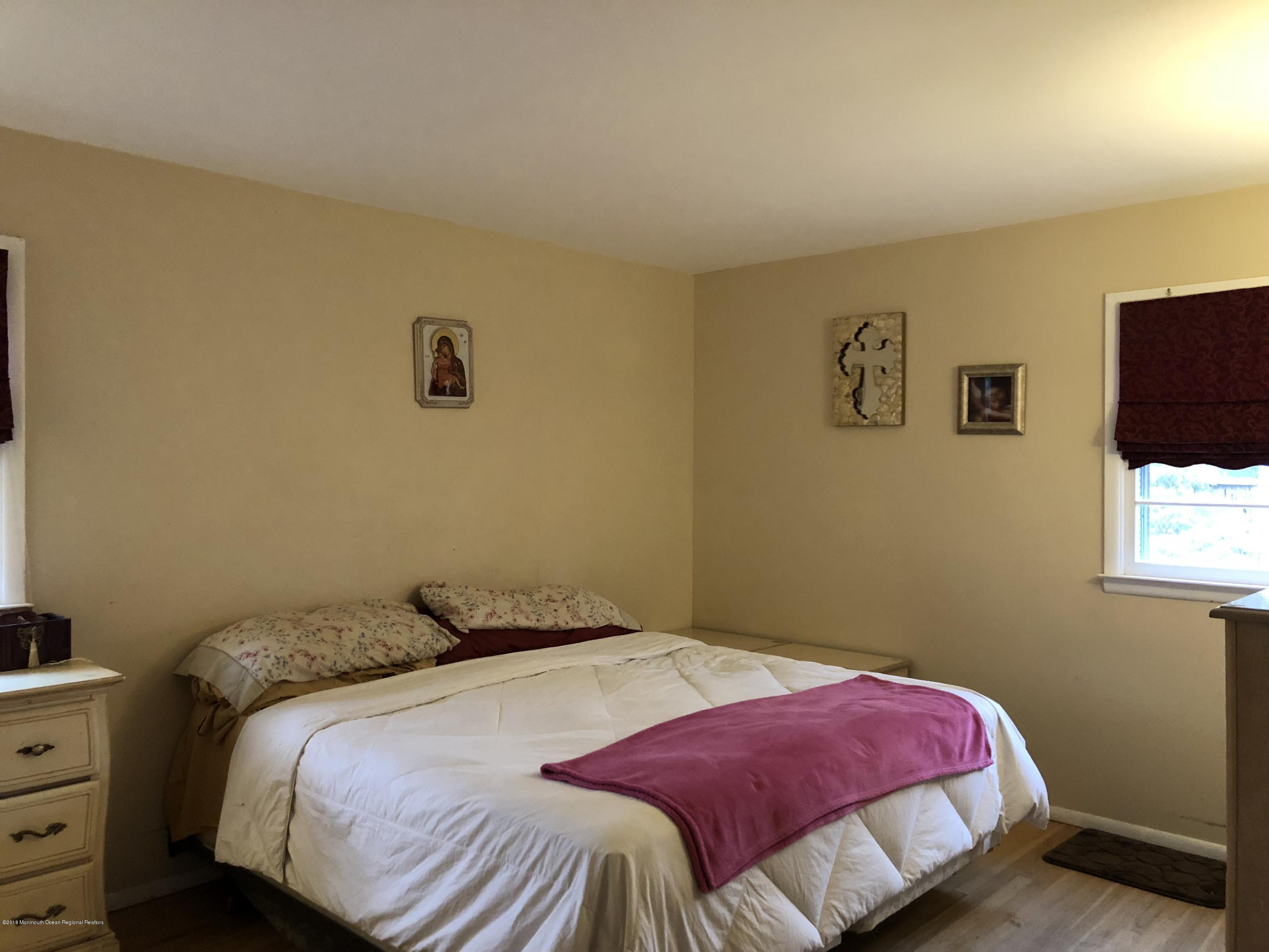 100 Sargent Road Freehold, NJ 07728 - Photo 17 of 30 a bedroom with a bed and a window