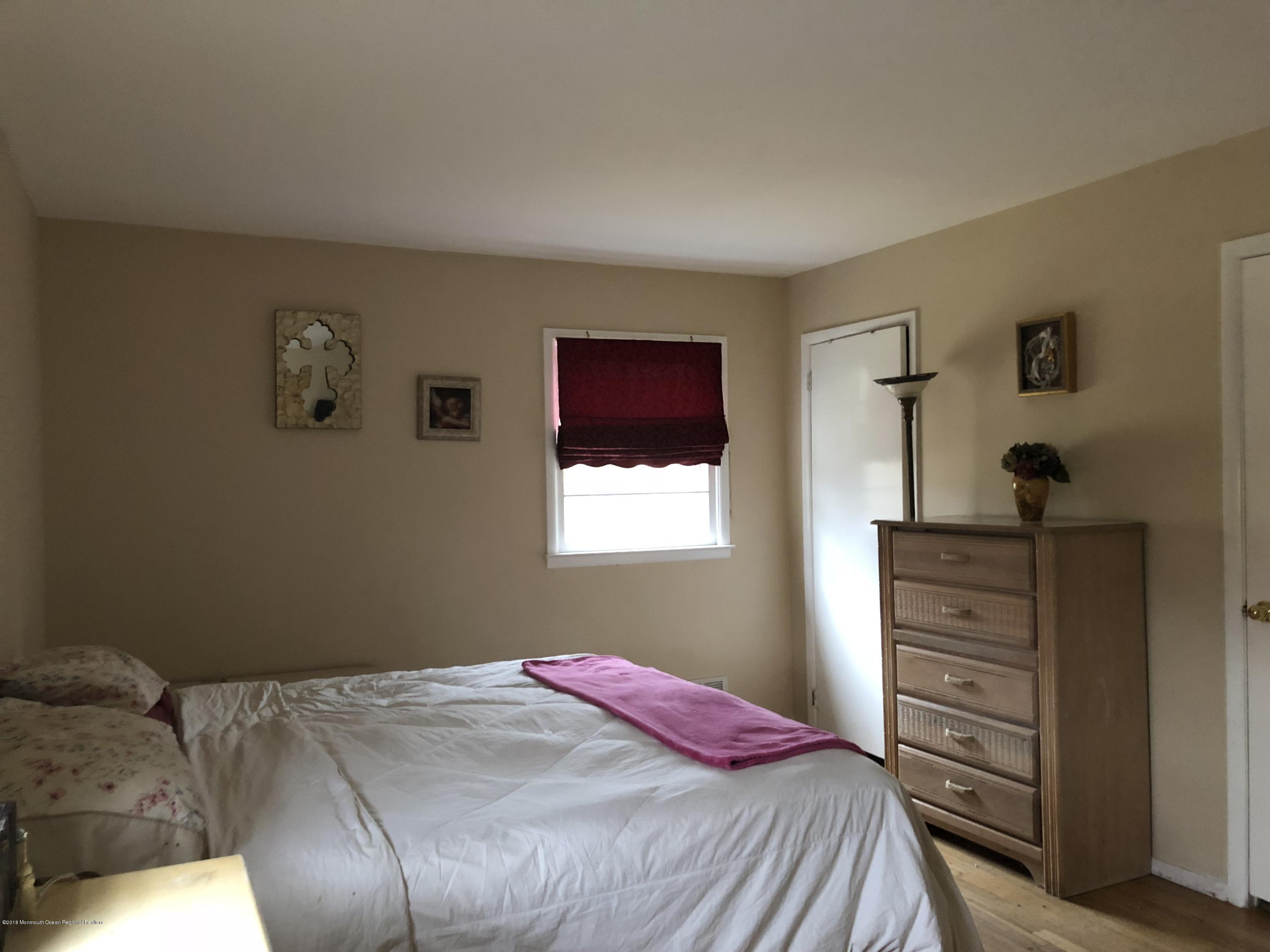 100 Sargent Road Freehold, NJ 07728 - Photo 19 of 30 a bedroom with a bed and a window