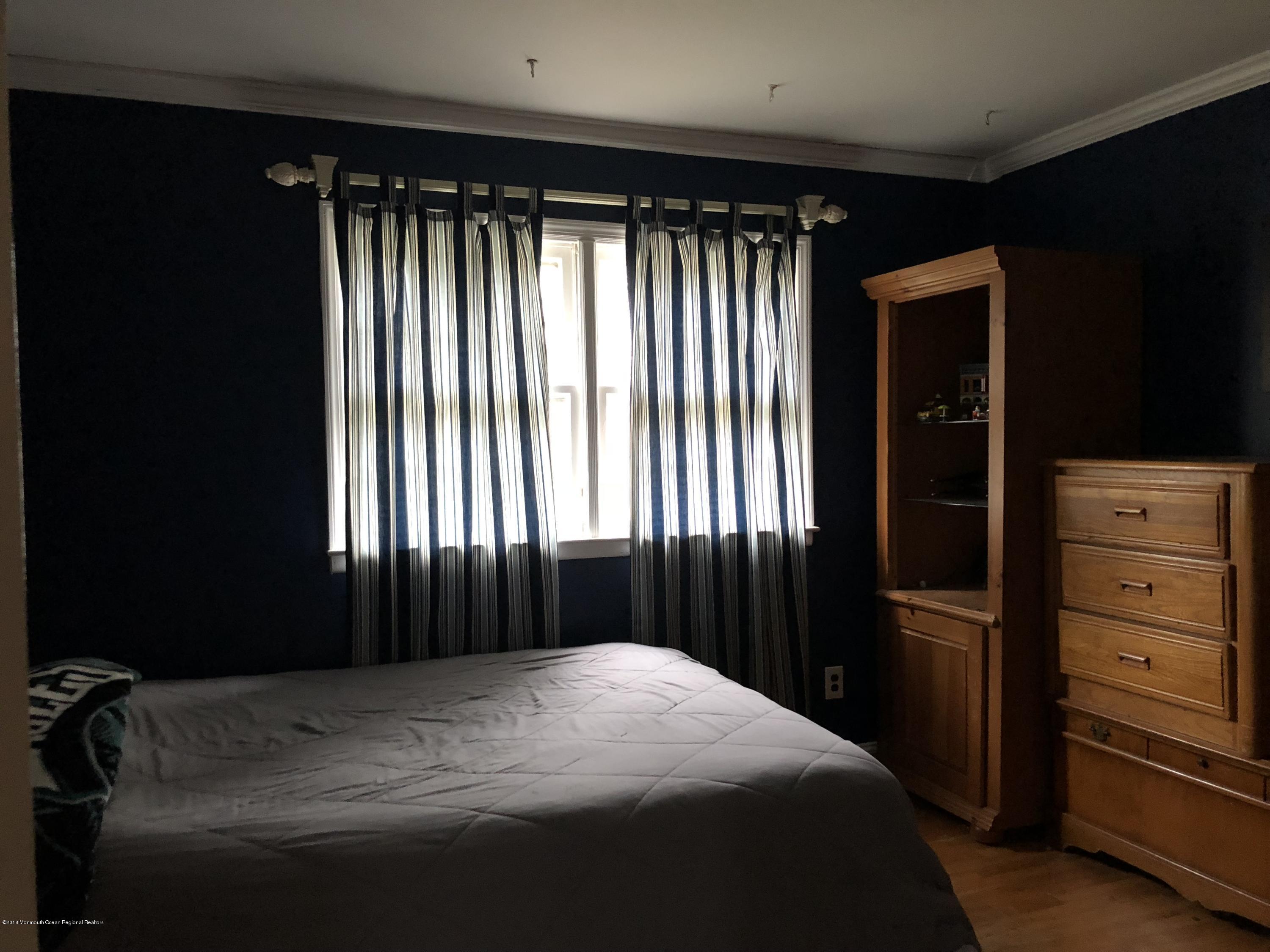 100 Sargent Road Freehold, NJ 07728 - Photo 20 of 30 a bedroom with a bed and a window