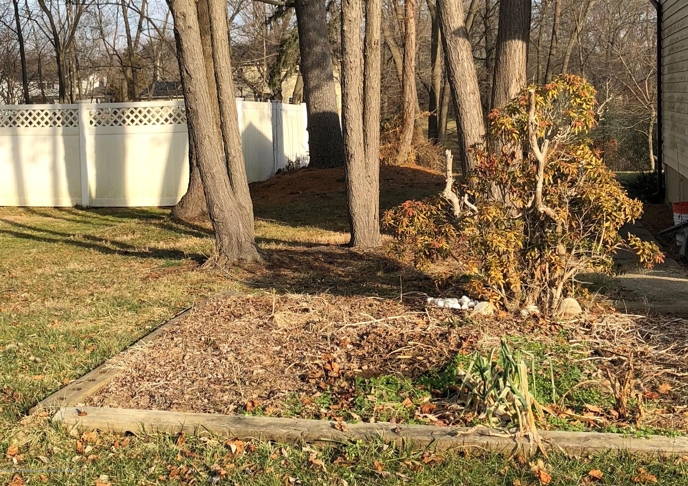 100 Sargent Road Freehold, NJ 07728 - Photo 29 of 30 a view of a backyard of the house