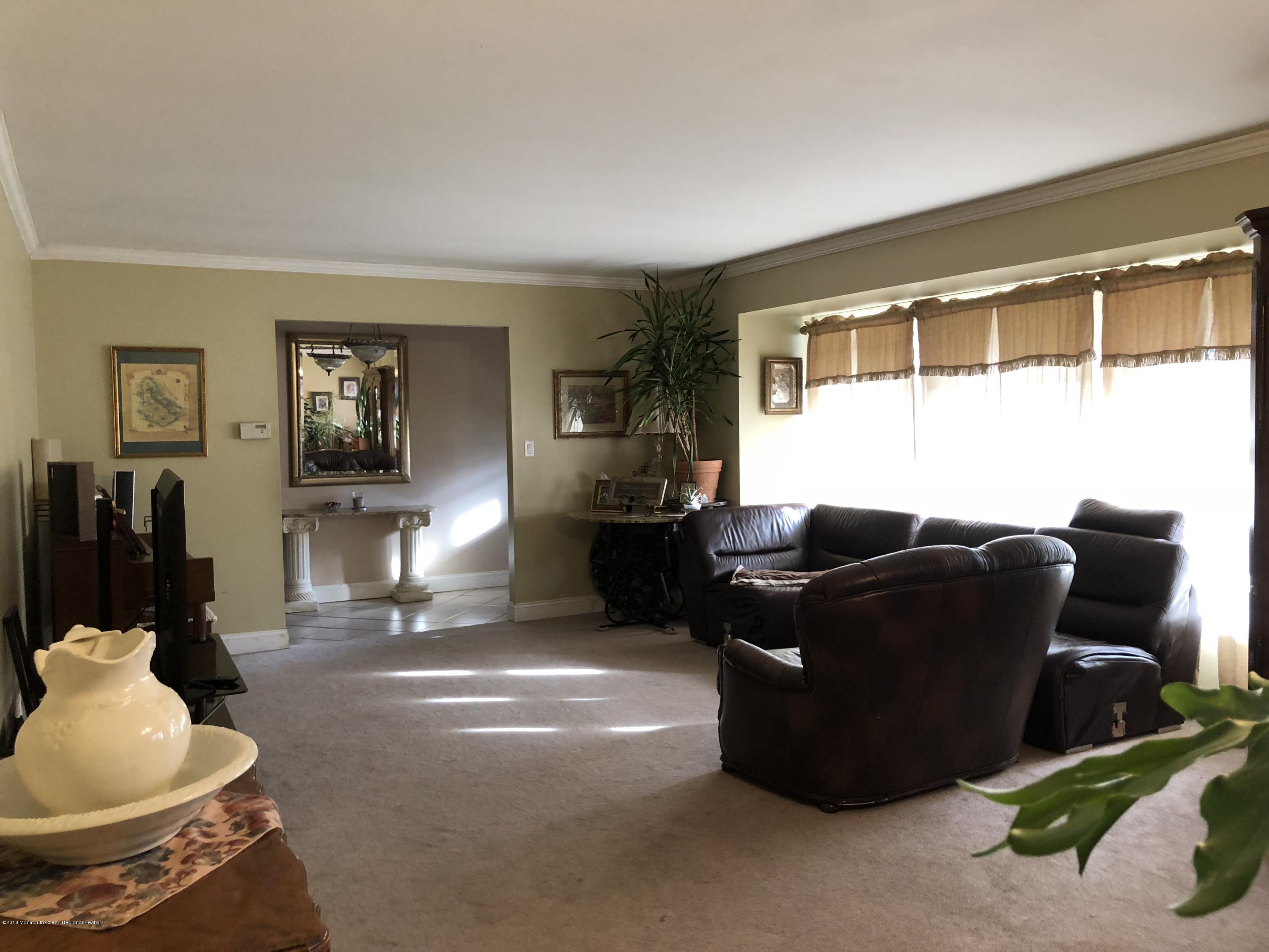 100 Sargent Road Freehold, NJ 07728 - Photo 6 of 30 a living room with furniture and a window