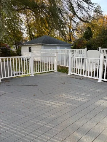 a view of deck and a yard