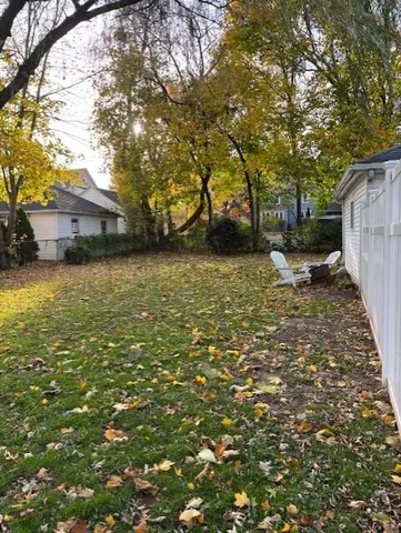 a backyard of a house with lots of green space