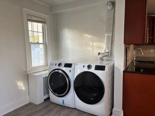 a view of a kitchen with washer and dryer