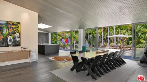 a kitchen with stainless steel appliances granite countertop a sink and a stove