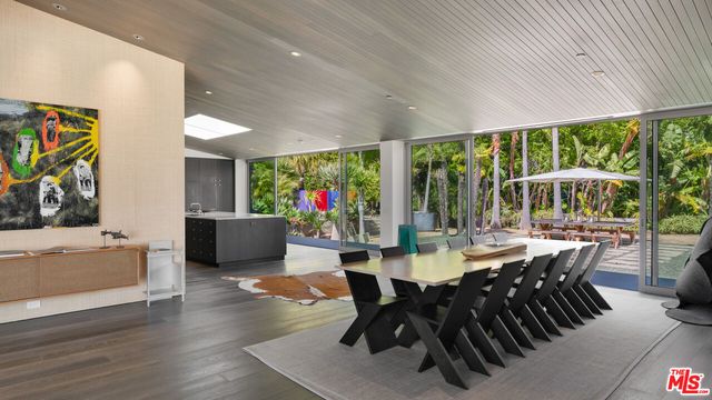 a kitchen with stainless steel appliances granite countertop a sink and a stove