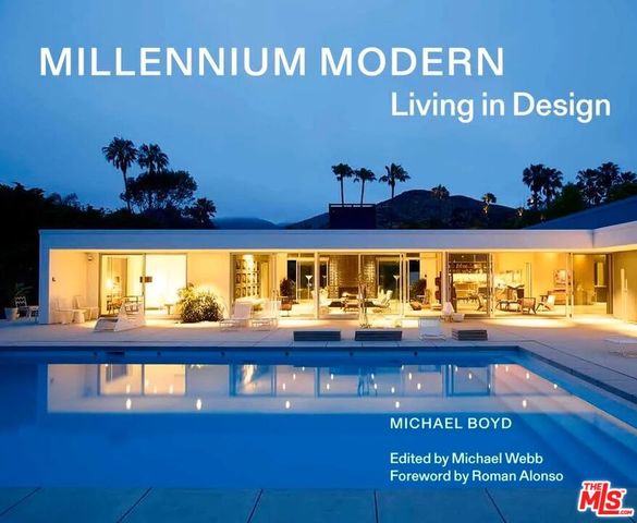 an aerial view of a house with swimming pool and garden