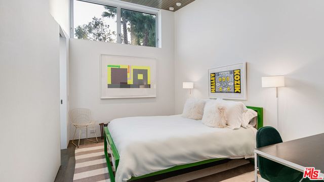 a swimming pool with outdoor seating and yard