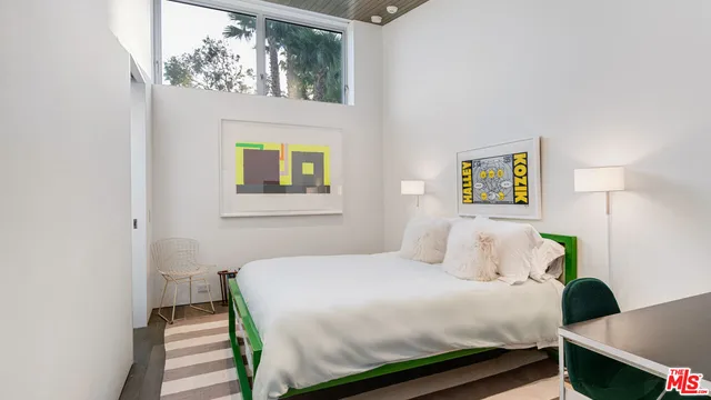 a swimming pool with outdoor seating and yard