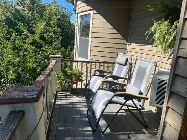 a view of balcony with furniture