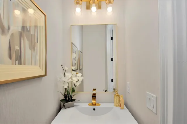 a bathroom with a sink and a mirror