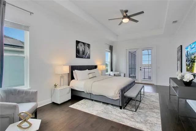 a bedroom with a bed and a chandelier