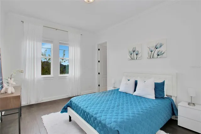 a bedroom with a bed and window