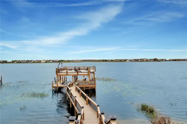 a view of a lake in middle of forest