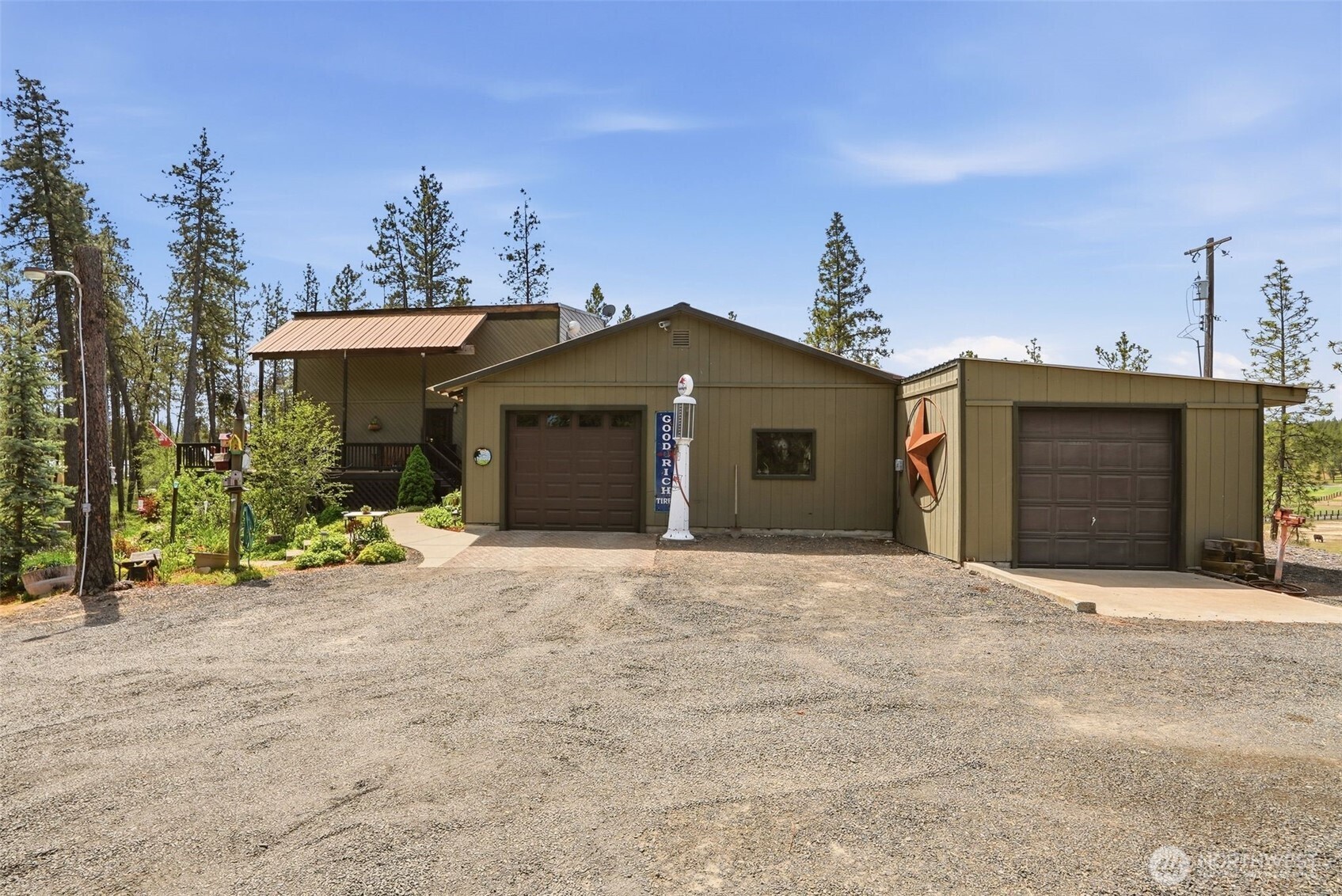 12119 South Spotted Road Cheney, WA 99004 - Photo 2 of 40 a front view of a house with a yard and garage