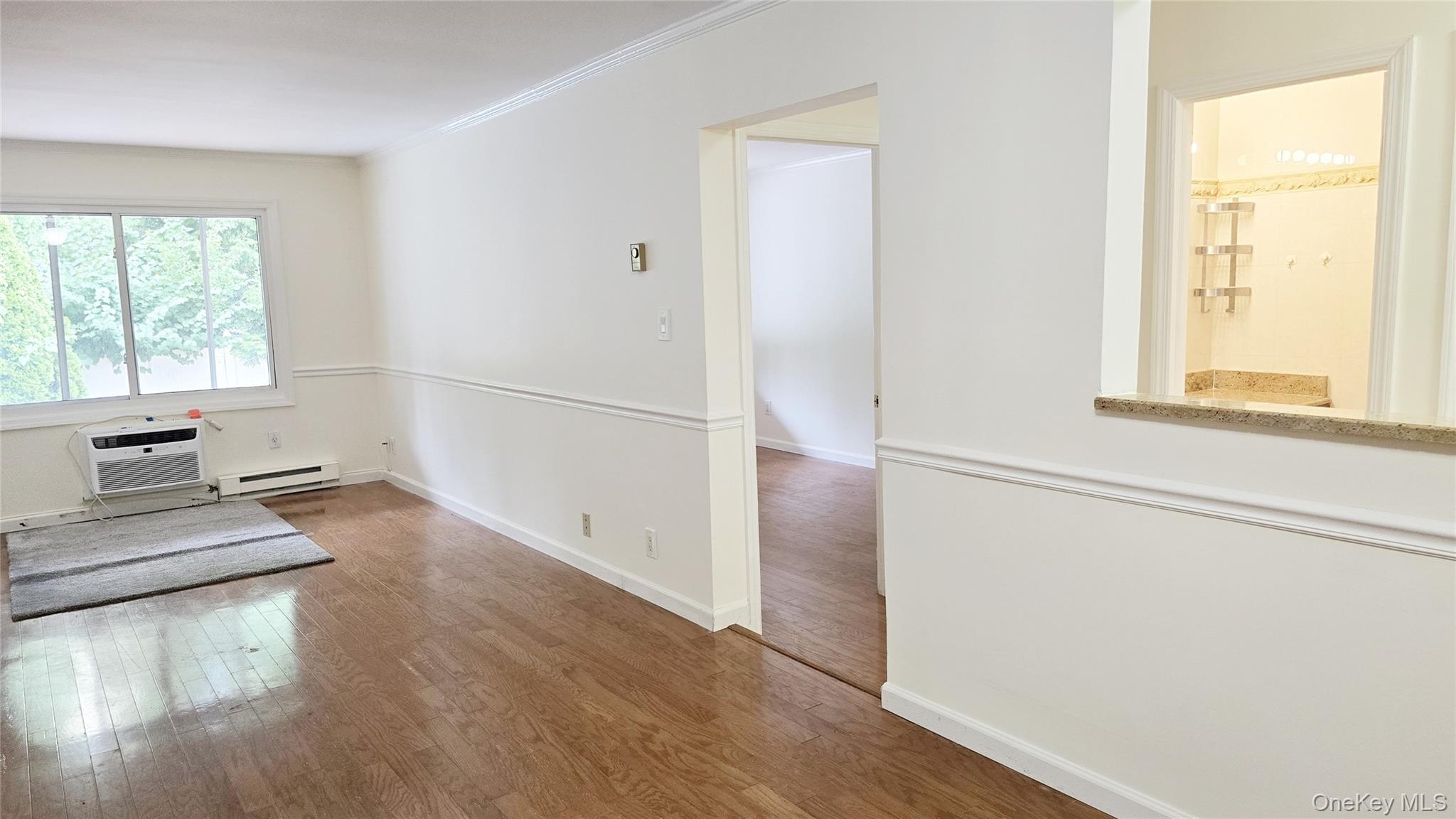 209-08 23rd Avenue Queens, NY 11360 - Photo 12 of 26 a view of a kitchen with wooden floor and electronic appliances