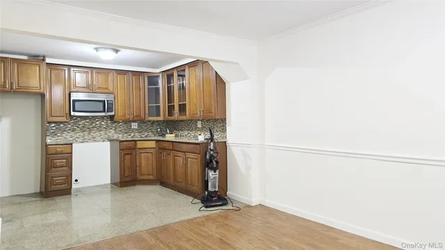 a kitchen with stainless steel appliances granite countertop a sink and cabinets
