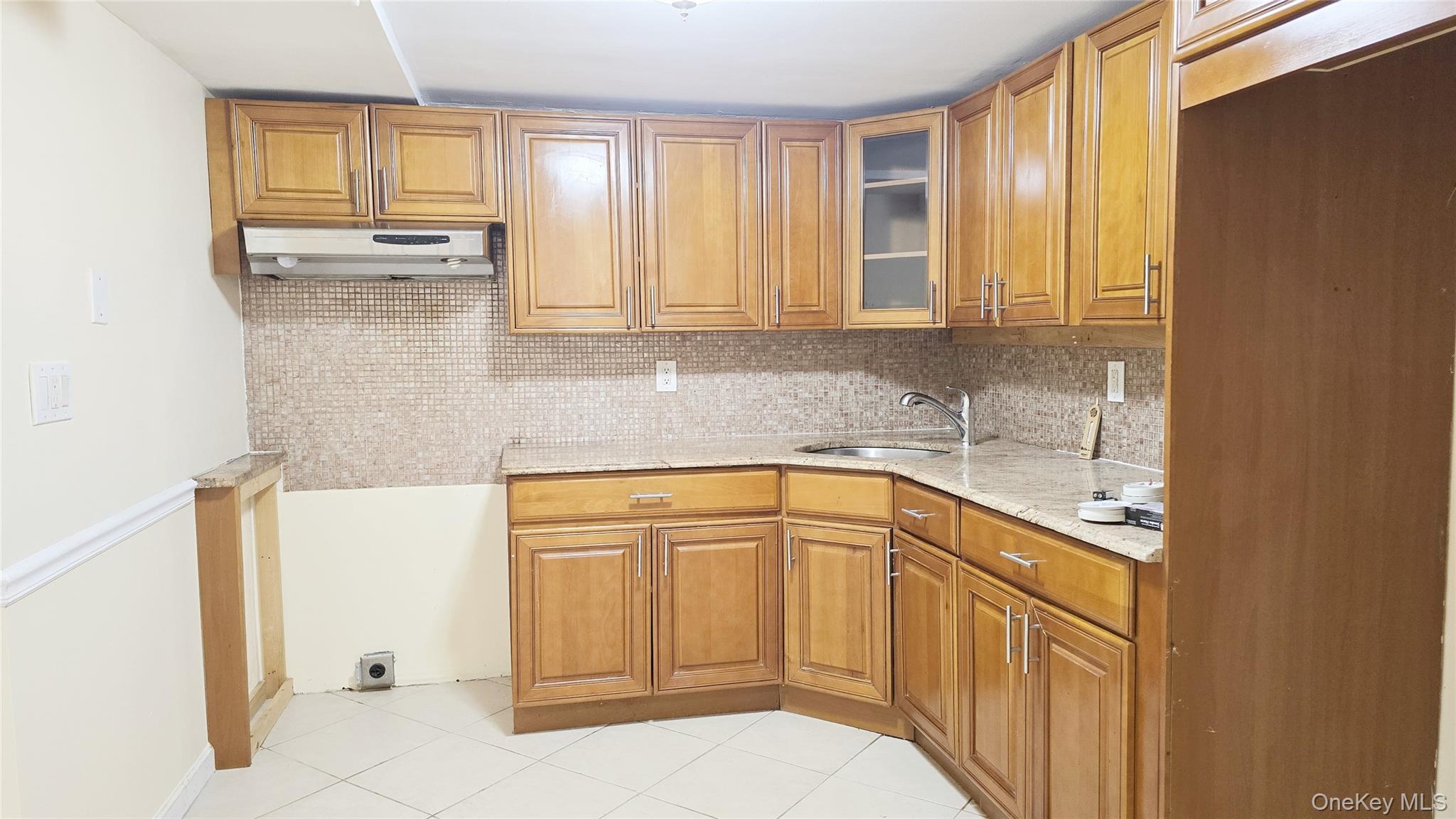 209-08 23rd Avenue Queens, NY 11360 - Photo 19 of 26 a kitchen with stainless steel appliances granite countertop a sink and cabinets