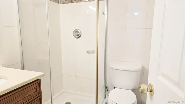 an entryway with wooden floor and cabinet