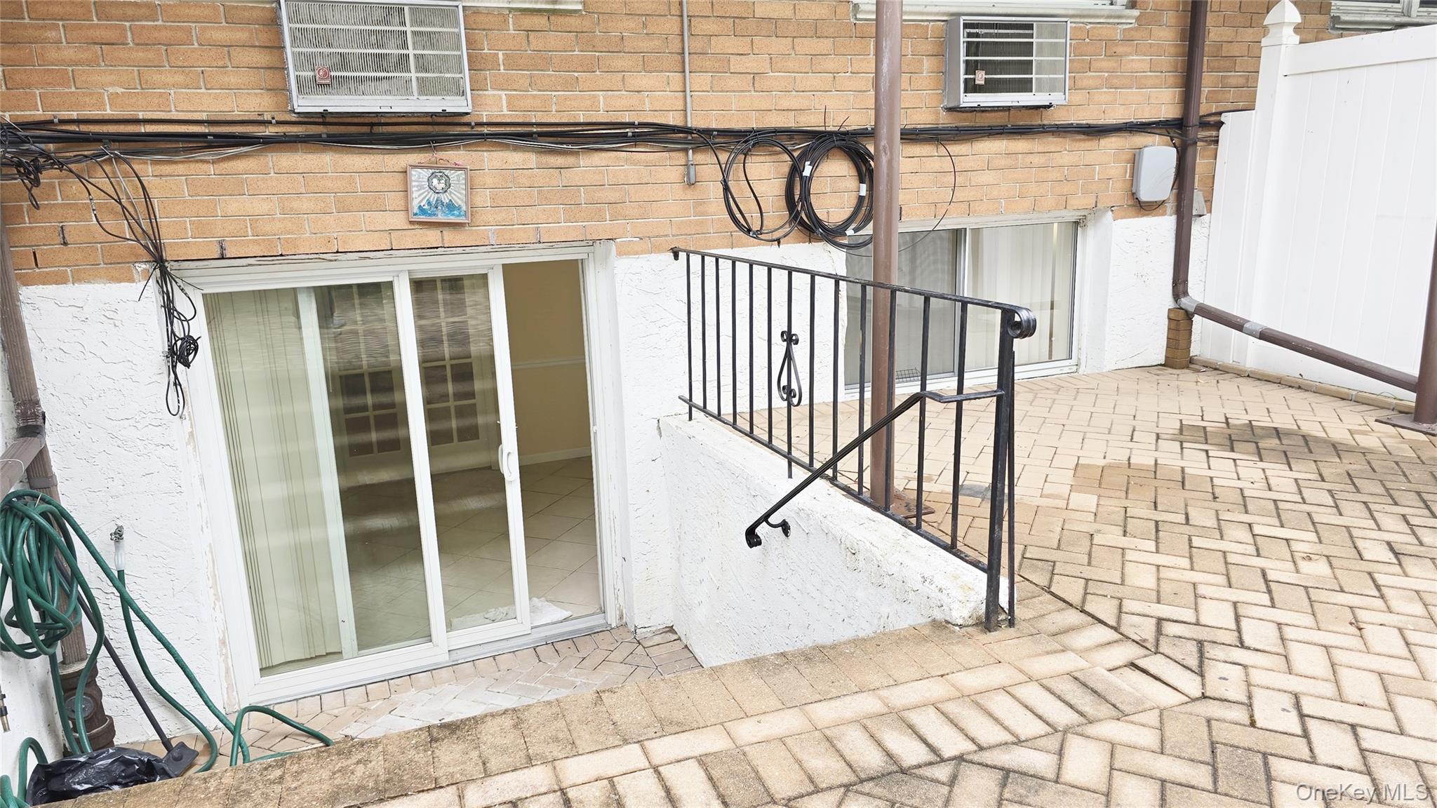 209-08 23rd Avenue Queens, NY 11360 - Photo 24 of 26 a view of a brick house with a window