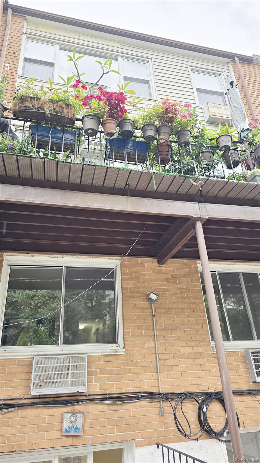 209-08 23rd Avenue Queens, NY 11360 - Photo 25 of 26 a view of a balcony with a potted plant