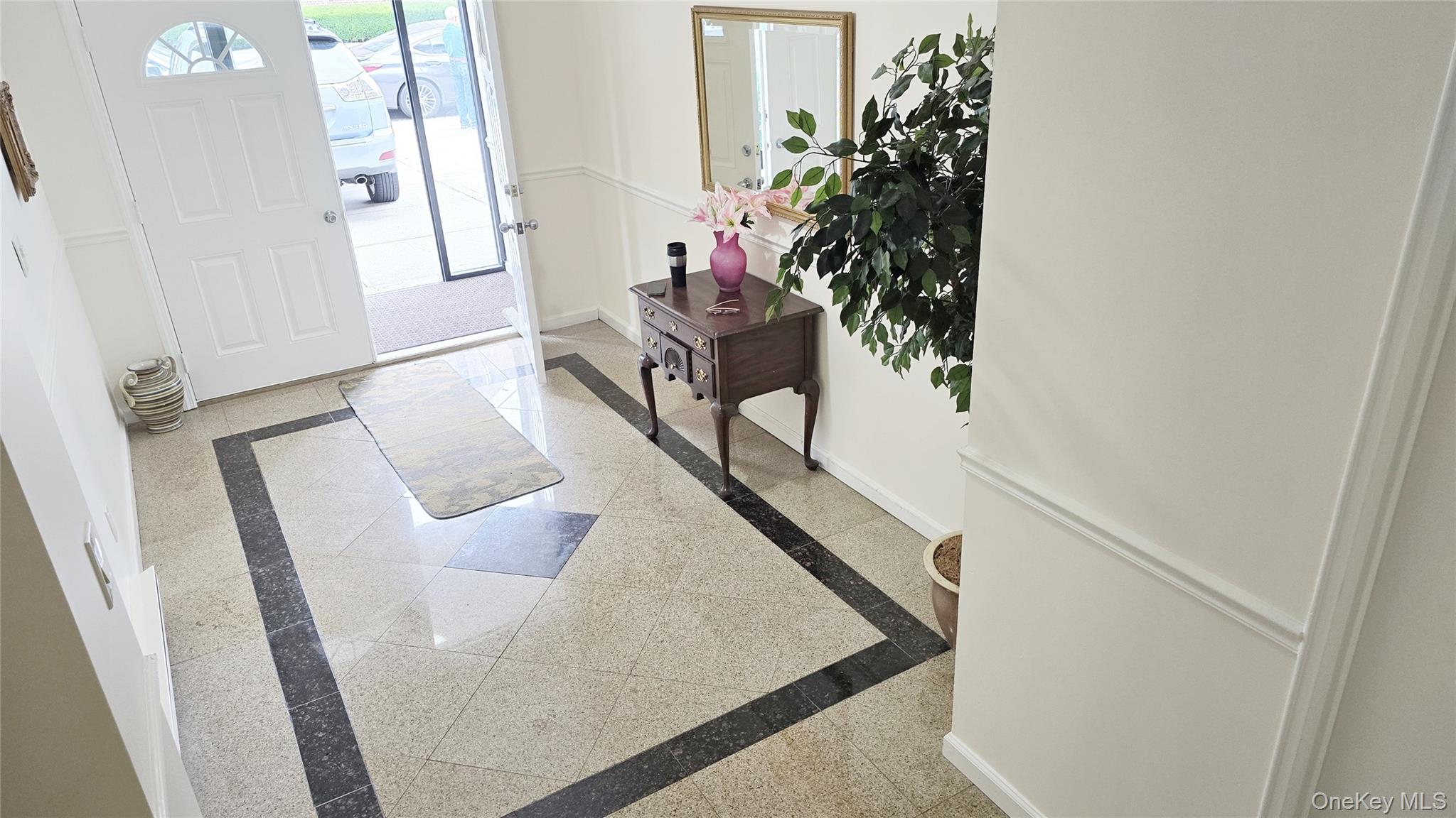209-08 23rd Avenue Queens, NY 11360 - Photo 3 of 26 a view of living room with furniture and a potted plant