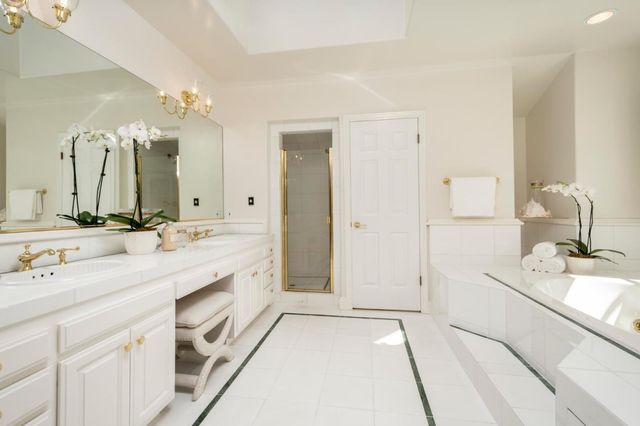 a spacious bedroom with two beds and a table