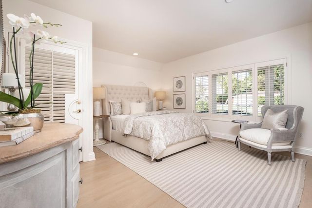 a view of backyard with plants and outdoor seating