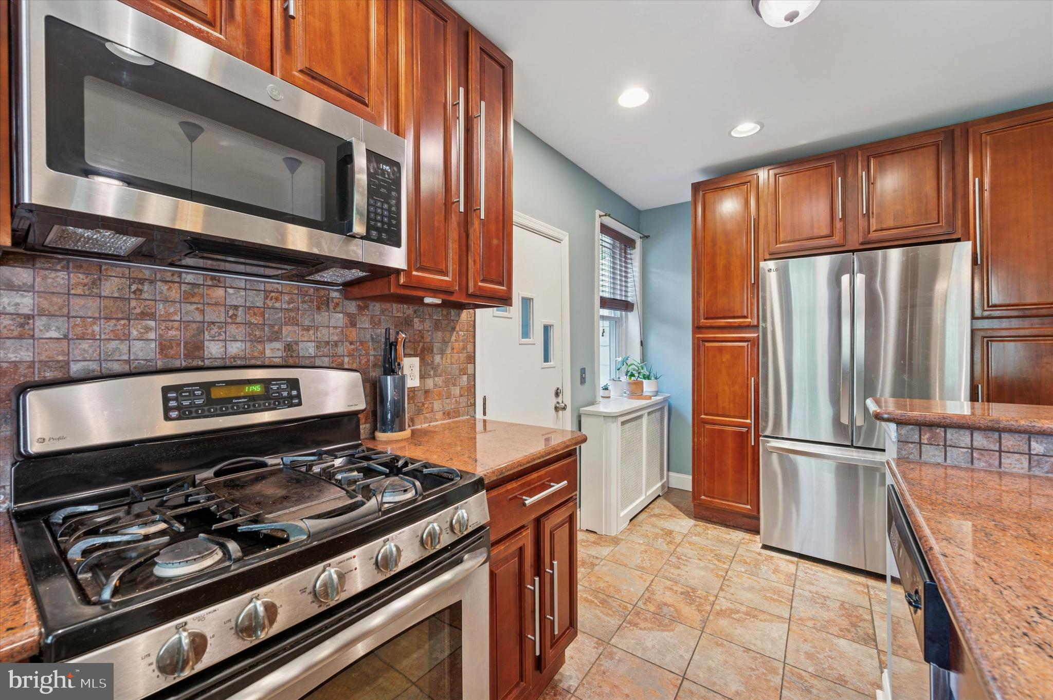 13 Chatham Road Ardmore, PA 19003 - Photo 19 of 35 a kitchen with a stove and a microwave