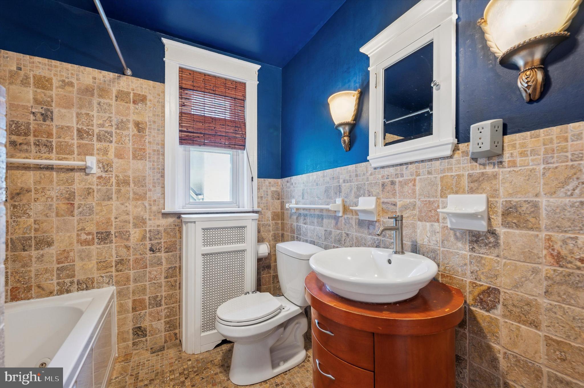 13 Chatham Road Ardmore, PA 19003 - Photo 27 of 35 a bathroom with a sink a toilet and a mirror