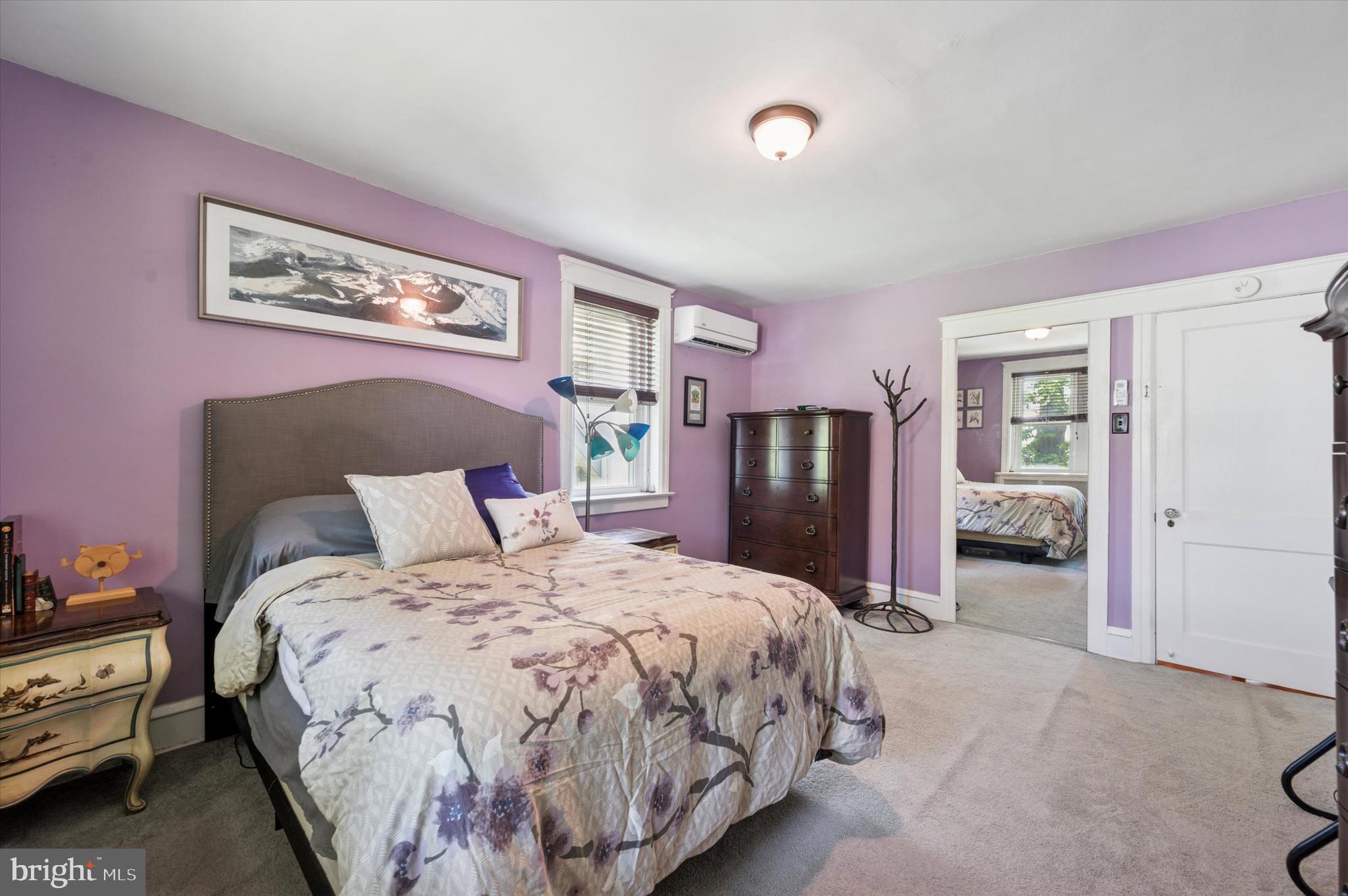 13 Chatham Road Ardmore, PA 19003 - Photo 29 of 35 a bedroom with bed and a chandelier