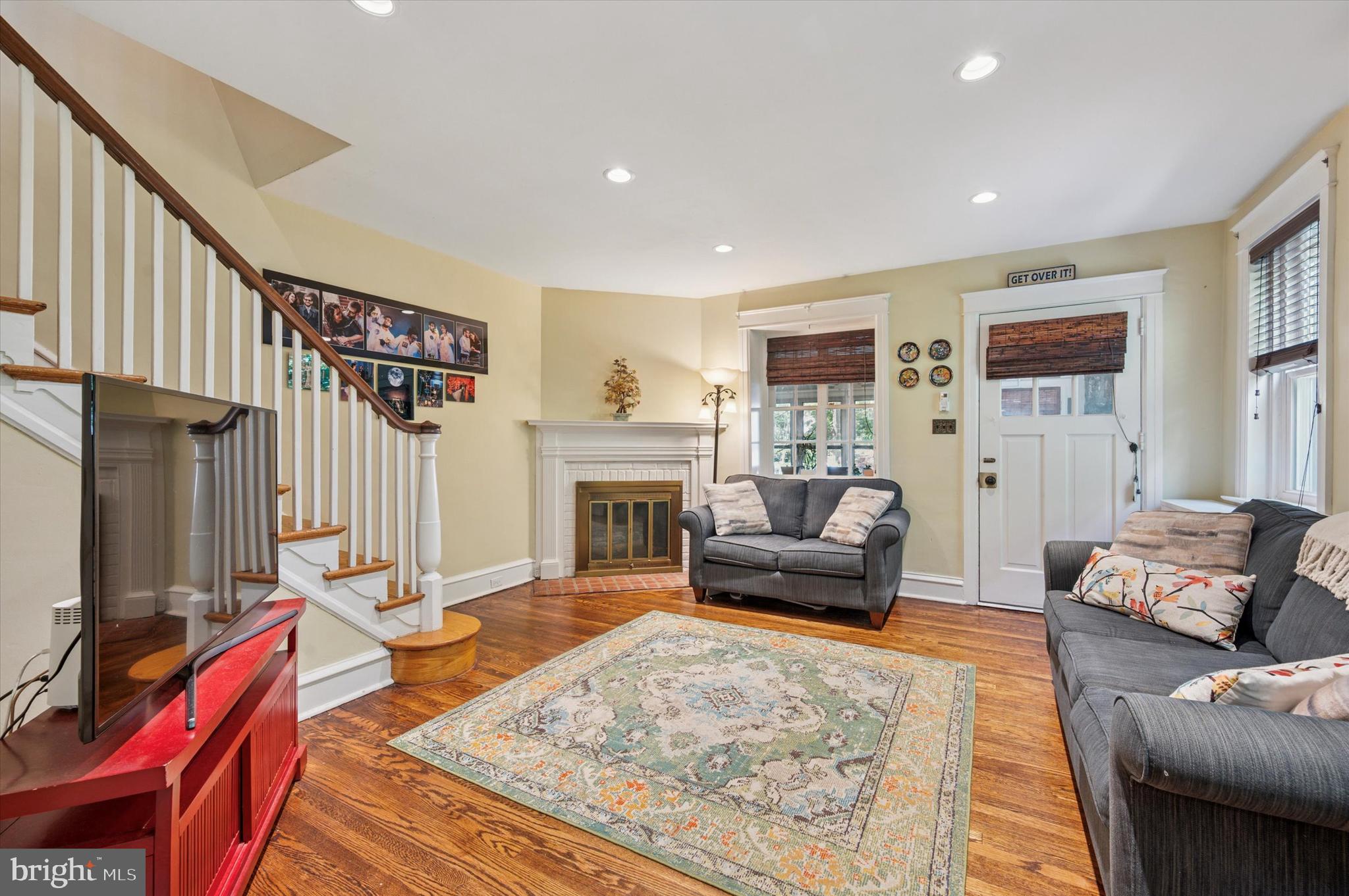 13 Chatham Road Ardmore, PA 19003 - Photo 8 of 35 a living room with furniture or couch and a fireplace