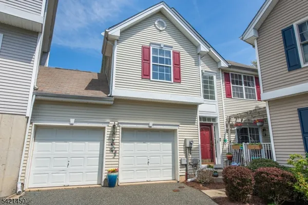 a front view of a house with a garage