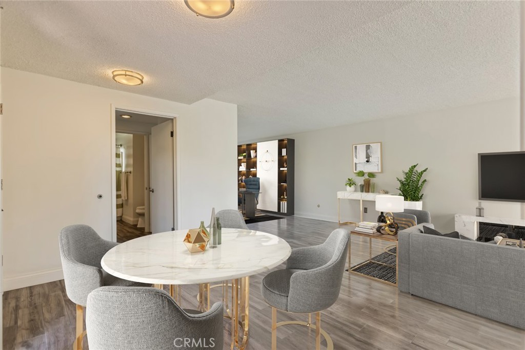 23033 Maple Avenue, Unit A Torrance, CA 90505 - Photo 15 of 45 a view of a dining room with furniture and wooden floor