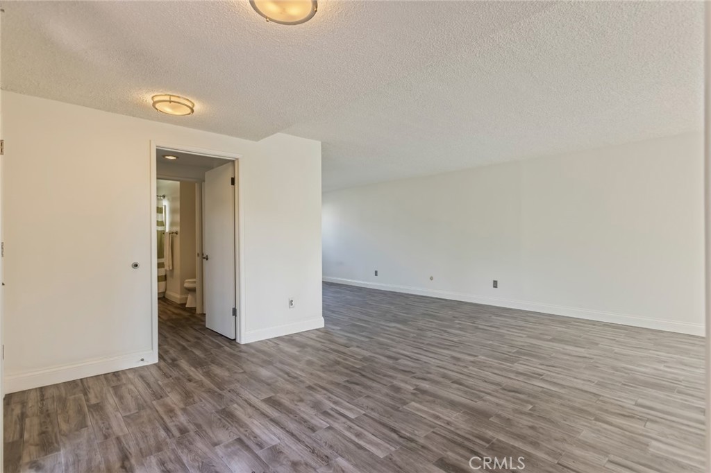 23033 Maple Avenue, Unit A Torrance, CA 90505 - Photo 16 of 45 a view of a room with wooden floor