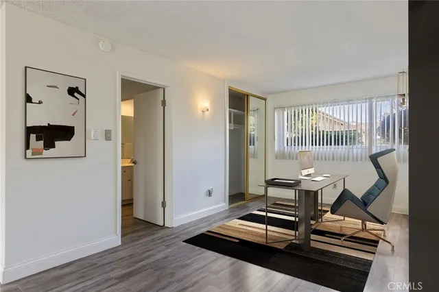 a view of a room with gym equipment and windows