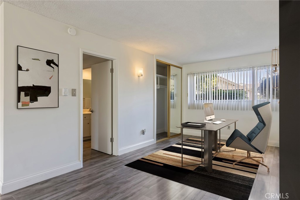 23033 Maple Avenue, Unit A Torrance, CA 90505 - Photo 17 of 45 a view of a room with gym equipment and windows