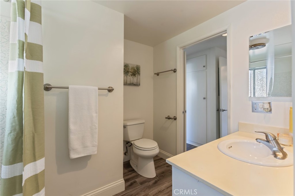23033 Maple Avenue, Unit A Torrance, CA 90505 - Photo 19 of 45 a bathroom with a sink a toilet and shower