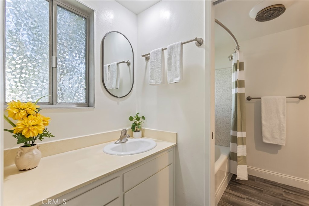 23033 Maple Avenue, Unit A Torrance, CA 90505 - Photo 21 of 45 a bathroom with a sink and a mirror