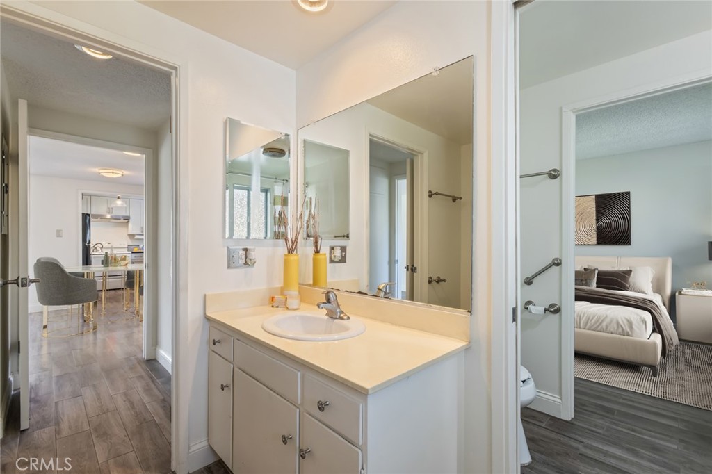 23033 Maple Avenue, Unit A Torrance, CA 90505 - Photo 22 of 45 a en suite bathroom with a sink and a mirror