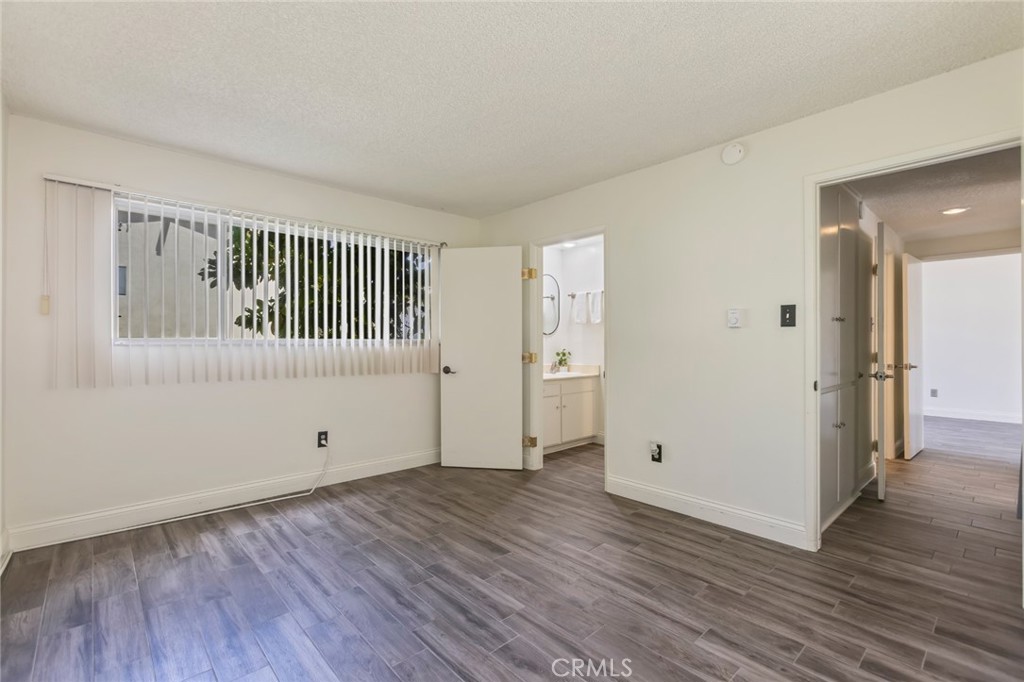 23033 Maple Avenue, Unit A Torrance, CA 90505 - Photo 25 of 45 a view of a room with wooden floor and a window