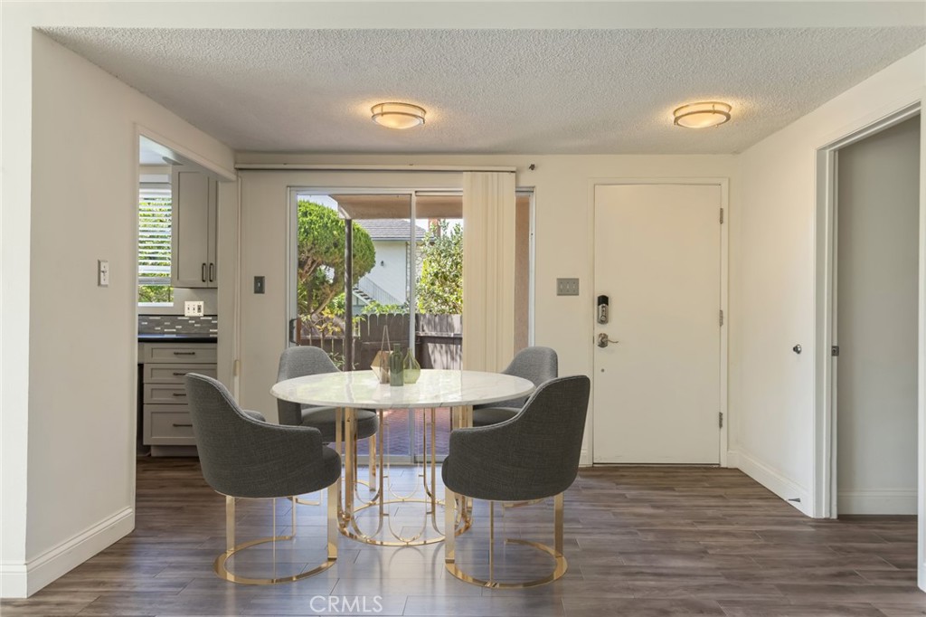 23033 Maple Avenue, Unit A Torrance, CA 90505 - Photo 3 of 45 a view of a dining room with furniture window and wooden floor