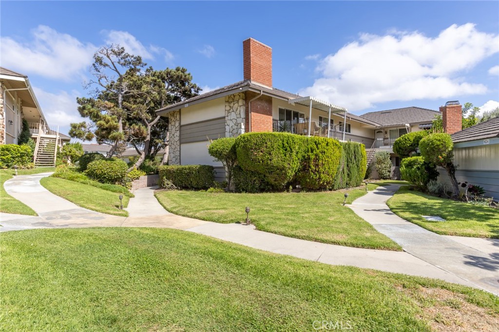 23033 Maple Avenue, Unit A Torrance, CA 90505 - Photo 32 of 45 a front view of a house with a yard