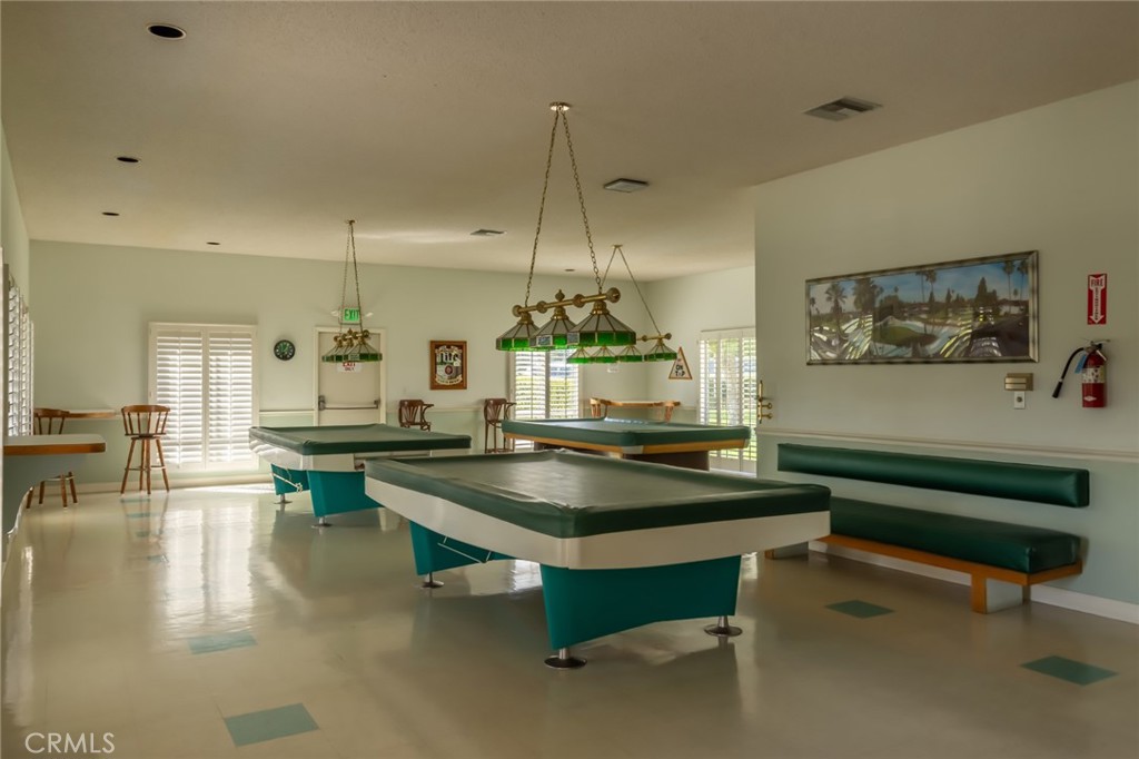 23033 Maple Avenue, Unit A Torrance, CA 90505 - Photo 36 of 45 a room with pool table and a chandelier